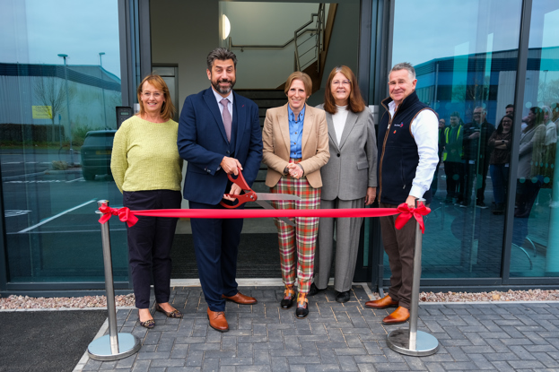 Members of Karndean Designflooring cutting the ribbon in front of their new site.